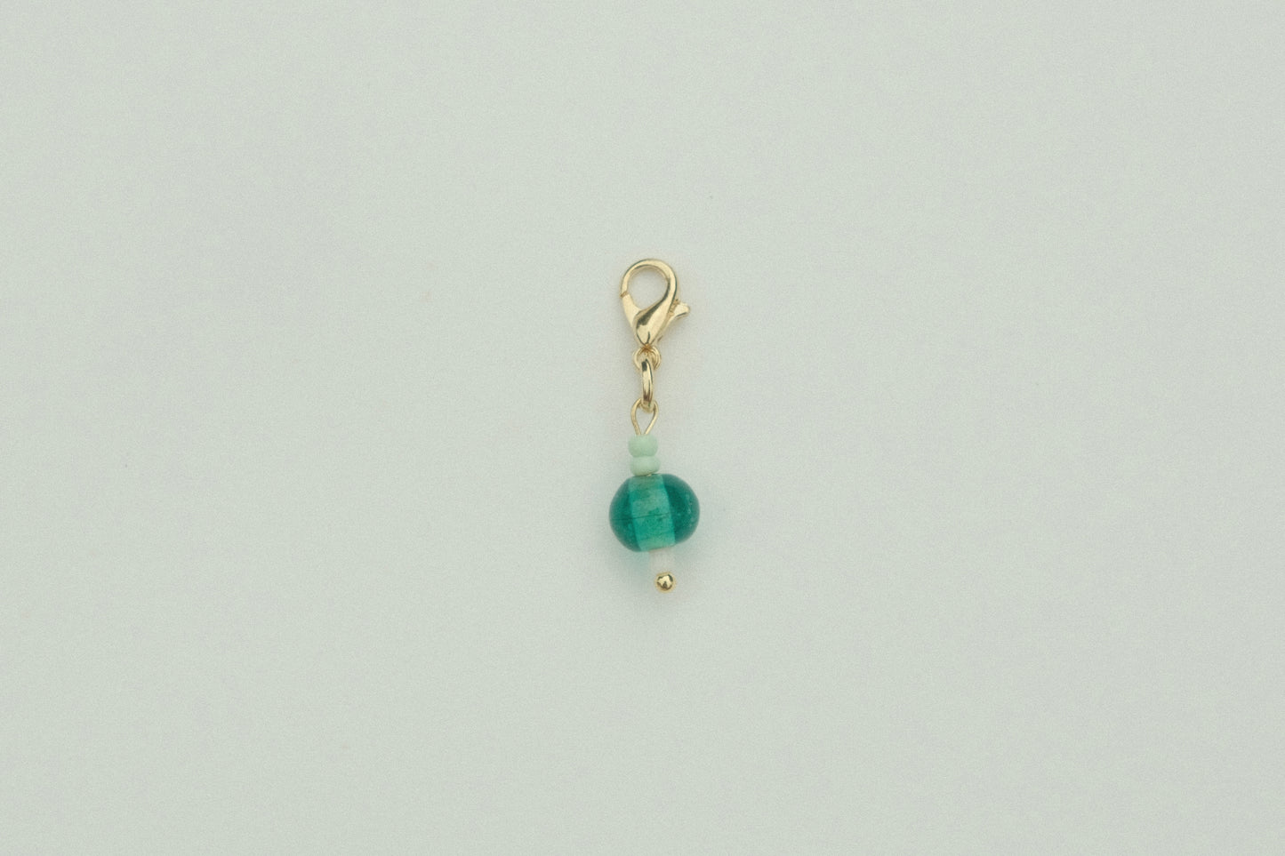 Teal droplet charm