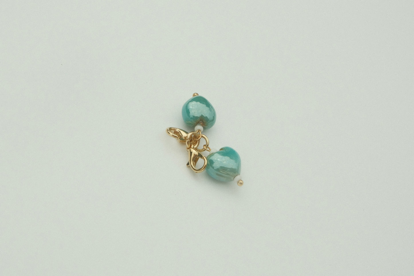 Teal heart charm